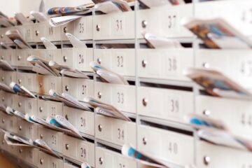 Direct Mail header image featuring mail boxes full of letters.