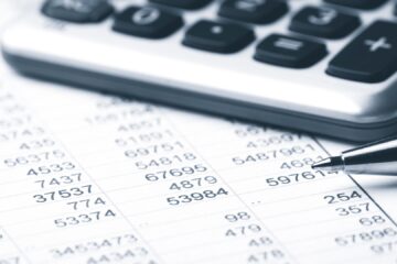 Save money on your next next print job - calculator and pen.