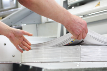 What is Bleed - print shop trimming a stack of paper
