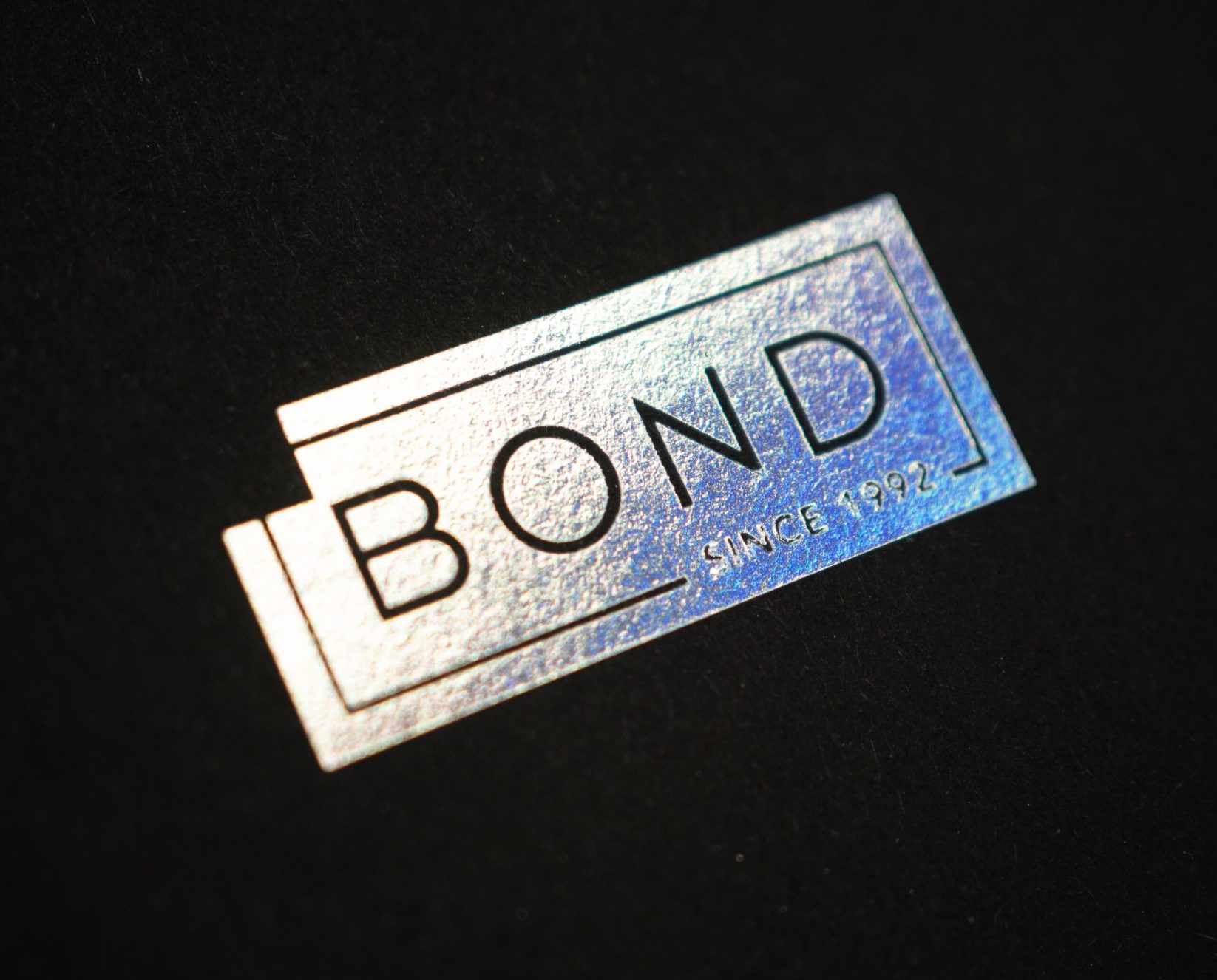 Custom finishing services - Bond Reproductions logo in holographic foil.