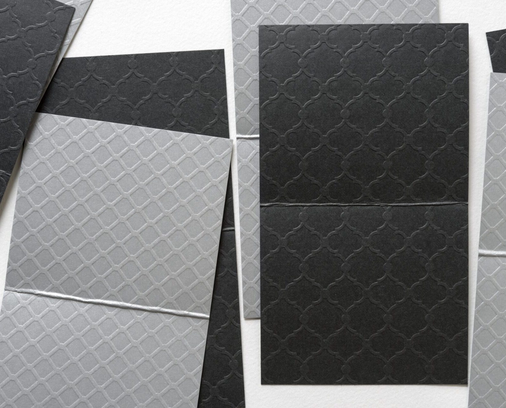 Unfolded,Paper,Cards,In,Gray,And,Black,With,Embossed,Pattern